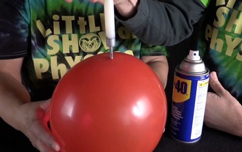 needle going through an inflated balloon